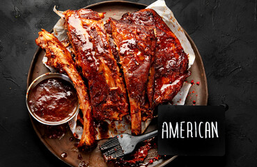 Grilled and smoked ribs with barbeque sauce.
