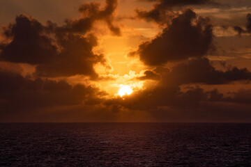 Idyllic Sunset Amidst Clouds at Sea