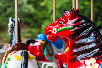 Merry-go-round Plastic Colorful Horses. Colorful Horse Detail Of Traditional Carousel Ride
