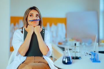 Funny Scientist Balancing a Pen on her Lips Feeling Bored. Stress relieving behavior at a demanding...