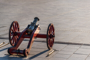Old Two Wheels Cannon Standing In A Town Square