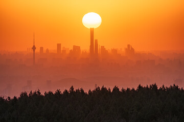 Sunrise of Beijing City with forest and landmarks