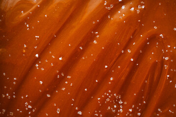 Homemade salted caramel sauce background texture