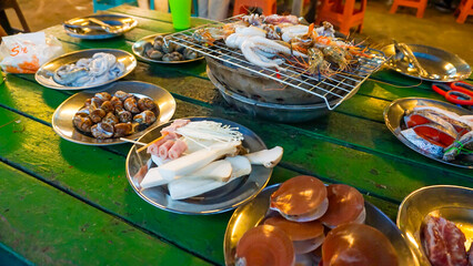 Indulge in a delectable array of seafood, featuring the beloved culinary treasures found in the bountiful waters of Thailand's southern coast