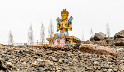 Large colorful Buddhist statue at the Diskit Monastery in the Nubra Valley in northern India - obrazy, fototapety, plakaty