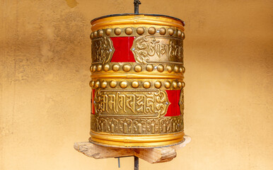 Close-up of a bronze prayer wheel at the Diskit Buddhist Monastery in northern India