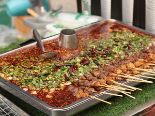 grilled beef with vegetables and herbs in spicy sauce