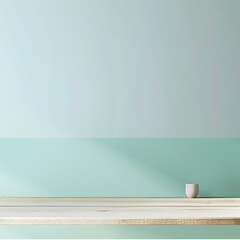 A white cup sits on a wooden table in front of a green wall. The table is empty, and the cup is the only object on it
