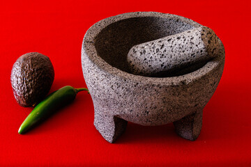 Mexican molcajete with chili and avocado