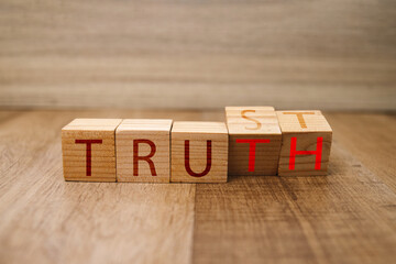 Flip Wood Cube Changes The Word Trust to Truth.