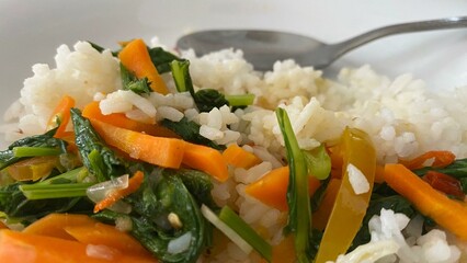 Breakfast with a healthy menu of green vegetables with carrots and tomatoes