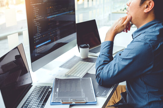 Developing programmer Team Development Website design and coding technologies working in software company office