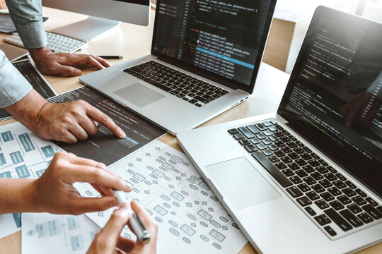 Developing programmer Team Development Website design and coding technologies working in software company office