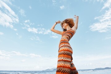 Smiling Woman Dancing on Beach: Happy Traveler in Hippie Style Backpacking Adventure