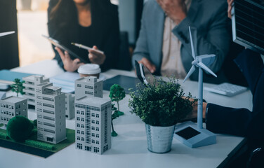 Green energy business company meeting with business people planning and discuss marketing of sustainable and renewable clean energy product with solar cell and wind turbine generator. Trailblazing
