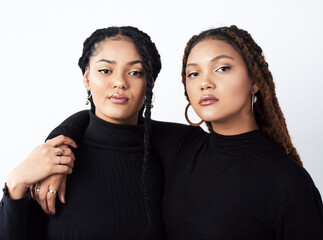 Braids, portrait or serious black woman with sister in studio on white background for natural...