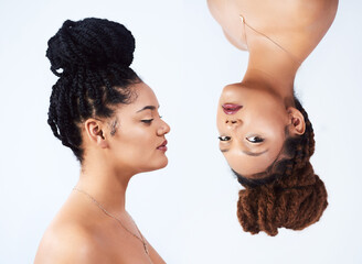 Sisters, upside down and beauty in studio, glow and luxury makeup cosmetics on white background....