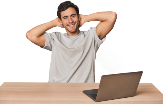 Hispanic young man working on laptop stretching arms, relaxed position. - Powered by Adobe