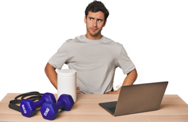 Hispanic trainer planning workout confused, feels doubtful and unsure.