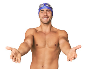 Young Hispanic man with swim gear showing a welcome expression.