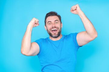 Surprised excited shocked face of millennial man isolated on studio background. Handsome happy...