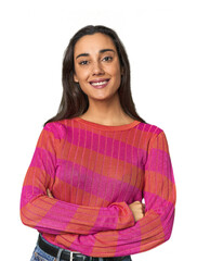 Hispanic young woman who feels confident, crossing arms with determination.