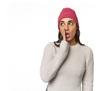 Hispanic young woman is saying a secret hot braking news and looking aside