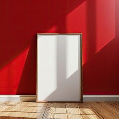 Dynamic Contrast: Empty Poster Frame Against Red Wall on Wood Floor