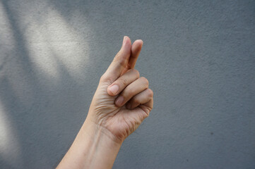 Korean symbol of love with fingers. A female hand depicts a heart.