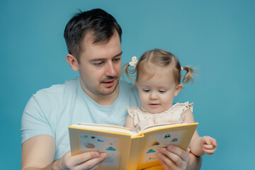A young father reading a book to his child in a serene setting with calming light, capturing a moment of parent-child bonding and learning, emphasizing the nurturing relationship and educational inter
