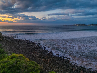 Obraz premium Aerial sunrise views over Bombo Beach at Kiama
