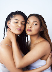 Women, portrait and beauty in studio, hug and love bonding on white background. Sisters, friends and embrace for relationship on backdrop, dermatology aesthetic and cosmetics for skincare or support