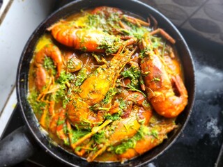 Shrimps cooked in olive oil lemon and garlic sauce