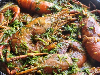 Shrimps cooked in olive oil lemon and garlic sauce