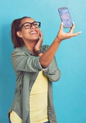 Happy woman, nerd and fashion with selfie for picture, memory or review on a blue studio...