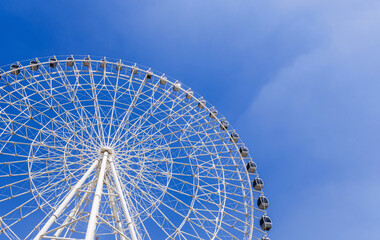 white big Ferris wheel on background a blue sky in the amusement park Navryz in Tashkent in Uzbekistan with copy space
