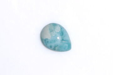 natural larimar gem stone on the white background