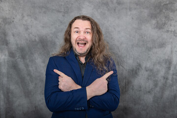 Long-haired businessman confidently posing in varied stances wearing a blue suit