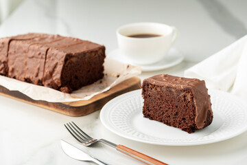 Fresh homemade chocolate sponge cake on wooden board