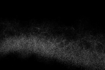 Black and white grunge texture background. Abstract splashes of water on dark backdrop. Light...