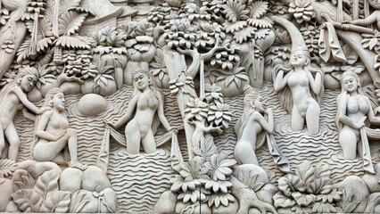 Bali MARCH 2024 - A bas relief Sculpture of Balinese life moments on a wall, Bali, Indonesia