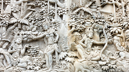 Bali MARCH 2024 - A bas relief Sculpture of Balinese life moments on a wall, Bali, Indonesia