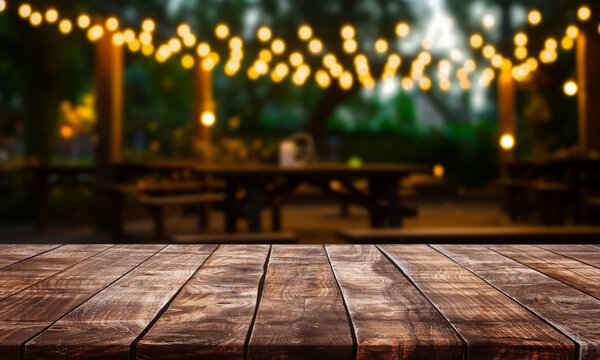empty modern wooden terrace with abstract night light bokeh of night festival in garden, copy space for display of product or object presentation, vintage color tone