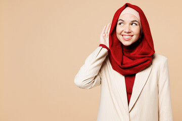 Young Arabian Asian Muslim woman wears red abaya hijab suit clothes try to hear you overhear...