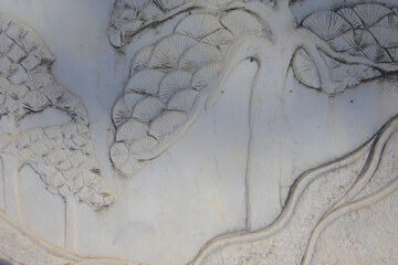 Obraz premium Vintage ornament on the stone. Close-up seamless texture. Stone texture. Embossed pattern.