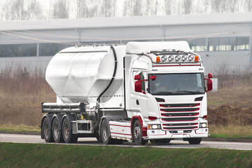 Chrome Cistern Carrying Oil and Gas Glides Through the City’s Veins of Commerce