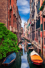 Colorful spring view of Vennice with famous water canal and colorful houses. Splendid morning scene in Italy, Europe. Magnificent Mediterranean cityscape. Traveling concept background.