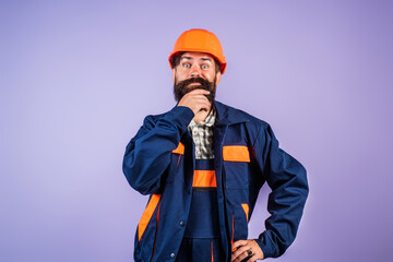 Engineer man, builder with building equipment. Safety helmet. Renovation. Man in hardhat. Heavy work. Labor day. Builder working. Hard job. Construction man, worker contractor foreman workman.