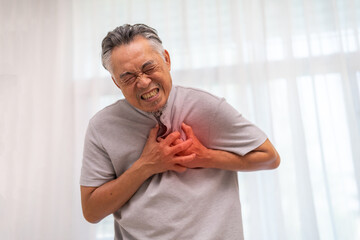 Senior asian adult elderly man with chest pain suffering from heart attack, health and medical,...