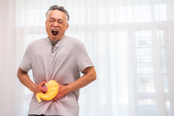Senior asian elderly man sick unhappy touching belly stomach with suffering from stomach ache pain,...